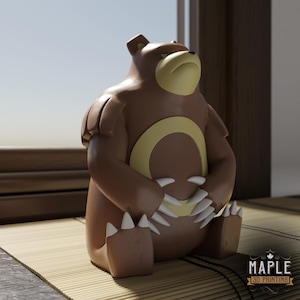 May include: A brown bear figurine with a cream-colored muzzle and a large cream-colored ring on its chest. The bear has white claws on its hands and feet, and the text "MAPLE 3D PRINTING" is visible in the bottom right corner of the image.