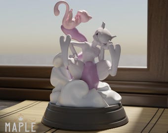 May include: A 3D printed figurine featuring a white Mewtwo character with purple accents, positioned above a smaller pink Mew character. The figures are mounted on a circular black base, with the text MAPLE 3D PRINTING visible at the bottom.
