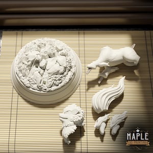 May include: A white unpainted 3D printed model kit featuring a circular rocky base, a quadruped animal torso, a separate head with fur details, a large flowing tail, and two smaller flame-like components, with a Maple 3D Printing logo in the corner.