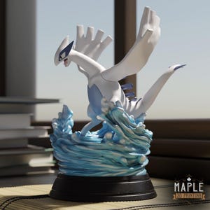 May include: A white and blue Lugia figurine standing atop a sculpted base of swirling blue water waves. The creature features large wings, a long neck, and a dark blue chest plate. The base is a solid black circular stand with the text Maple 3D Printing.