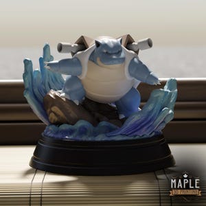 May include: A blue and white Blastoise figurine standing on a brown rock base surrounded by sculpted blue water waves. The character features two large cannons on its back and is mounted on a circular black pedestal. The text MAPLE 3D PRINTING is visible.