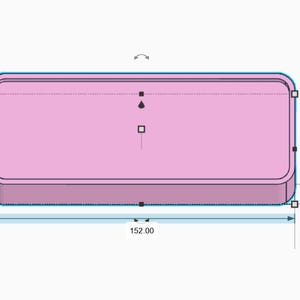 May include: A pink rectangular object with rounded corners. The dimensions are labelled: 152.00 units long, 77.32 units high, and 14.00 units thick. The object is set against a plain, light background.