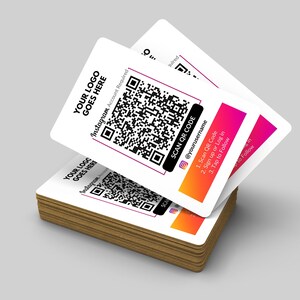 May include: A stack of white business cards with a black and white QR code, the text "YOUR LOGO GOES HERE", and the text "SCAN QR CODE" with instructions to scan the code, sign up or log in, and tap to follow on Instagram. The text "@yourusername" is also included.