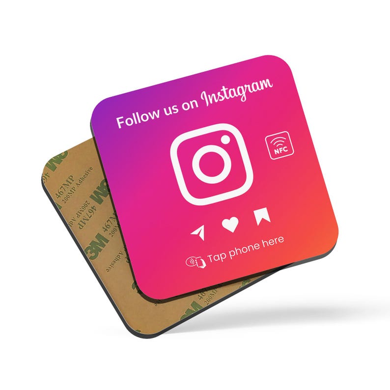 May include: A pink and red square sticker with the Instagram logo and the text "Follow us on Instagram". The sticker also has a small white icon that says "NFC" and the text "Tap phone here".
