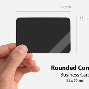 May include: A black business card with rounded corners. The card measures 3.35 inches by 2.17 inches.