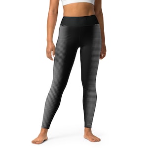 May include: Black leggings with a white polka dot pattern that fades from dark to light.