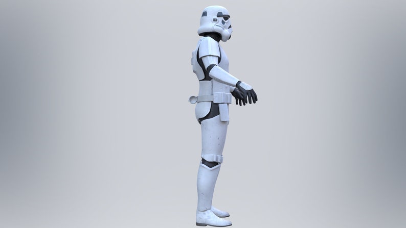 May include: A white stormtrooper action figure with black details. The figure is standing with its arms at its sides.