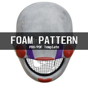 May include: A white mask with red circular cheeks, red lips, and purple vertical stripes extending from the eyes to the jaw. The mouth area features a black grid pattern. The text FOAM PATTERN PDO/PDF Template is centred over the mask.