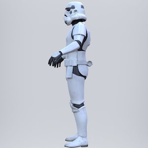 May include: A white stormtrooper action figure with black details, standing in a neutral pose with its arms by its side.