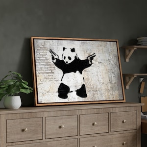 Framed Canvas Print Wall Art Banksy Panda with Handguns on Wall Cities Animals Digital Art Modern Art Chic Dark Black and White Wall Decor