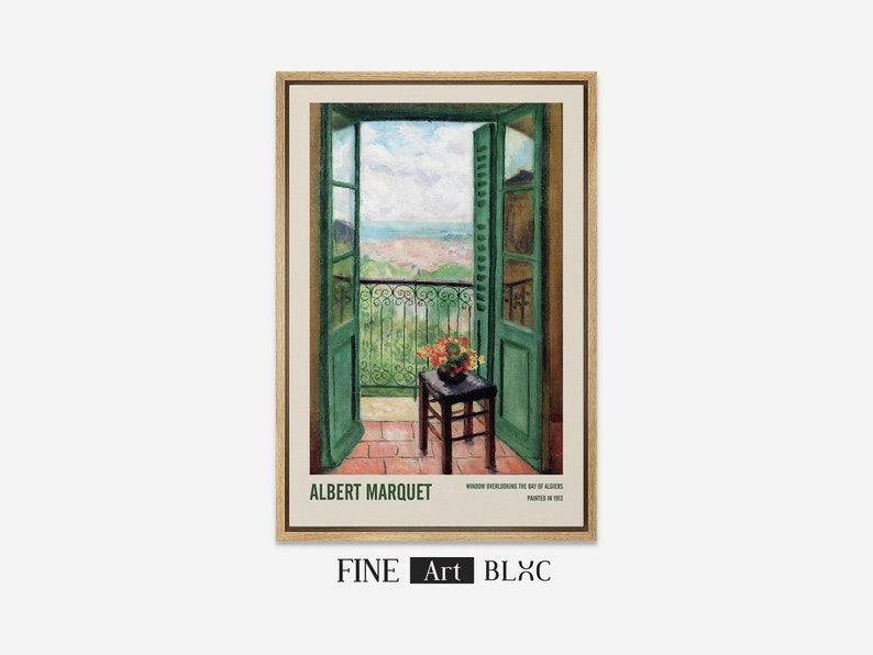 May include: A framed print of a painting by Albert Marquet titled "Window overlooking the Bay of Algiers" painted in 1913. The painting depicts a view from a balcony with green doors and a small table with a vase of flowers.