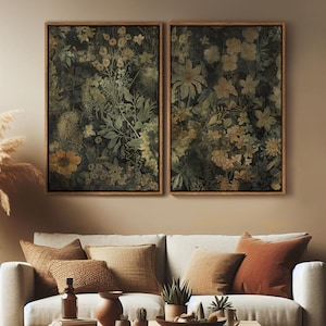 May include: Two framed botanical prints with a dark green background and faded yellow flowers. The prints are displayed on a beige wall above a light beige couch with brown throw pillows.