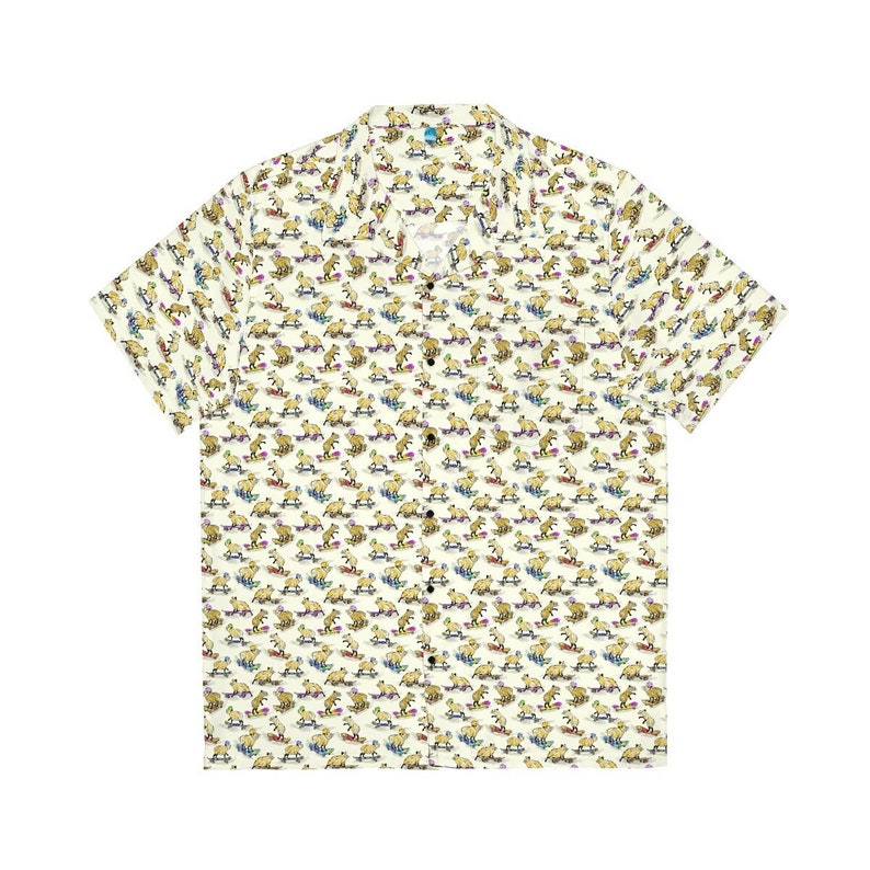 May include: A white short-sleeved button-down shirt with a repeating pattern of brown capybaras riding skateboards. The capybaras are wearing colorful hats and sunglasses.