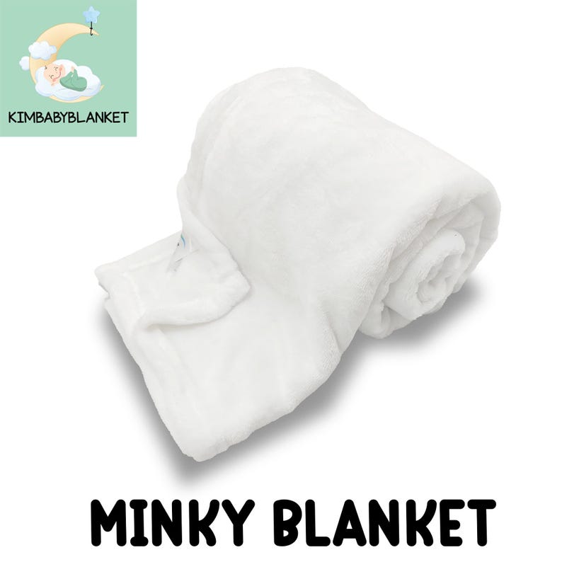 A white, fluffy, and soft-looking blanket is shown in the image.