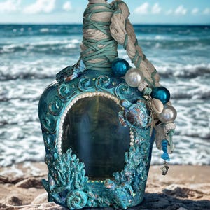 May include: A set of three ceramic mugs with a speckled, matte finish. The mugs are in cream, light grey, and dark grey. Each mug has a simple, minimalist design, ideal for coffee or tea.