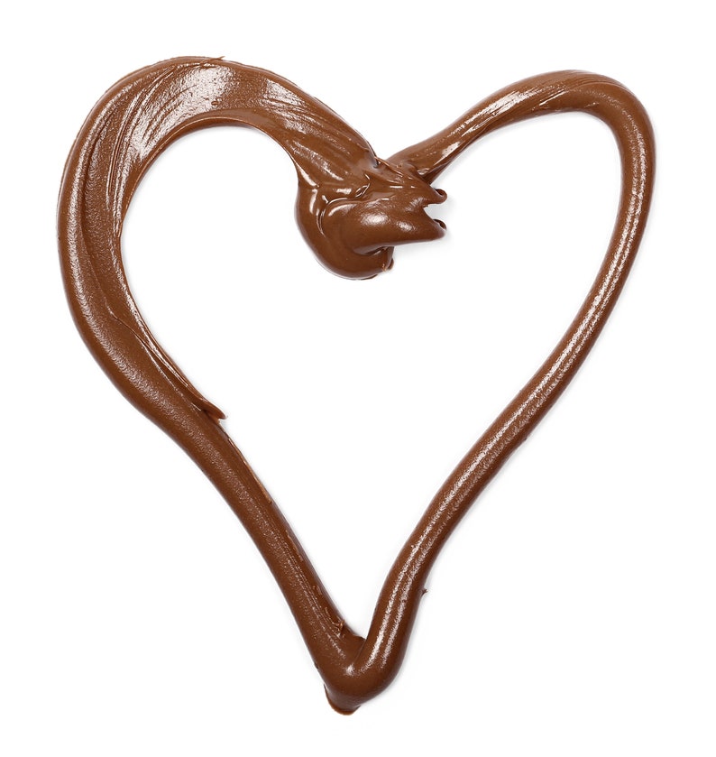 May include: A heart shape made from brown chocolate spread on a white background.
