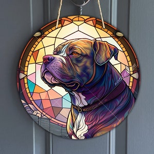 May include: A colorful stained glass style illustration of a brindle and white dog with a black collar. The dog is looking to the left and is set against a background of a circular stained glass design.