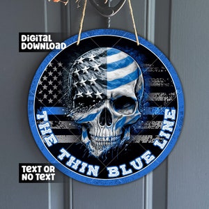 以下が含まれることがあります： 青と白のアメリカ国旗と、白い円の中に「The Thin Blue Line」という文字が書かれた頭蓋骨が描かれた丸い木製看板です。