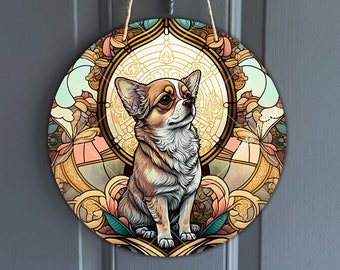May include: A round, decorative door hanger featuring a chihuahua dog in a stained glass style. The dog is brown and white with a light blue background. The design includes intricate floral patterns and gold accents.