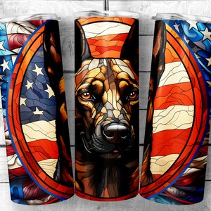 May include: A stainless steel tumbler with a colourful stained glass design featuring an American flag and a German Shepherd dog. The design is in shades of red, white, and blue.