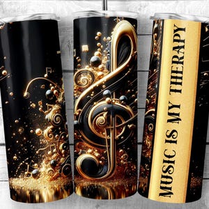 May include: Three stainless steel tumblers with a black and gold design. One tumbler features a treble clef with gold swirls and musical notes. Another tumbler has a gold background with the text "Music is my therapy".