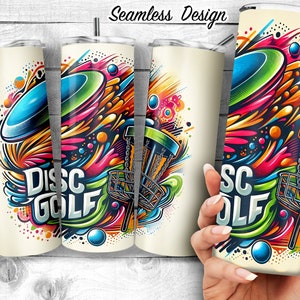 May include: A colourful, abstract design featuring a disc golf disc, a basket, and the words "Disc Golf". The design is on a white tumbler with a lid.