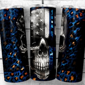 May include: Three stainless steel tumblers with a skull design. The tumblers are wrapped with a blue and orange leopard print design. The center tumbler features an American flag with a thin blue line.