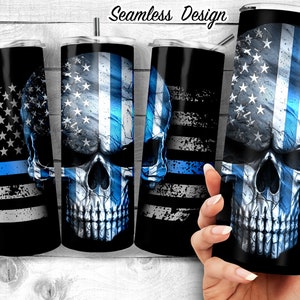 May include: Four stainless steel tumblers with a skull design and an American flag with a blue line. The tumblers are black with a blue, white, and gray design.