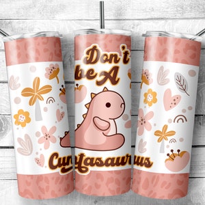 May include: Pink and white tumbler with a pink dinosaur and the text "Don't be a Cunyasaurus". The tumbler is decorated with a floral pattern in shades of pink, yellow, and brown.