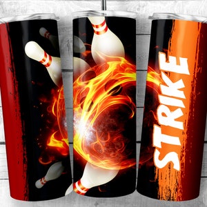 May include: A set of three stainless steel tumblers with a bowling theme. The tumblers feature a bowling ball with flames, bowling pins, and the word "STRIKE" in white letters on an orange background.