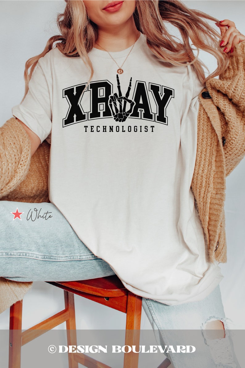 May include: White t-shirt with black text that reads "X-RAY TECHNOLOGIST" and a black skeleton hand making a peace sign.