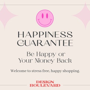 May include: A light beige rectangular sign with rounded corners featuring a pink smiley face icon and two pink four-pointed stars. The text reads: HAPPINESS GUARANTEE, Be Happy or Your Money Back, Welcome to stress free, happy shopping, DESIGN BOULEVARD.