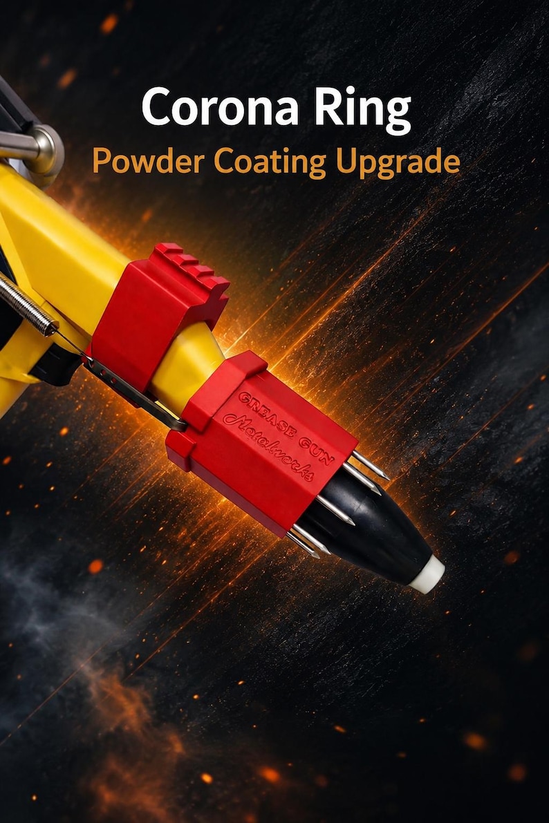 May include: A yellow powder coating corona ring attachment for a grease gun, featuring two red plastic components. The red part is embossed with the text Grease Gun Metalwerks. The device has a black nozzle tip and metallic prongs.