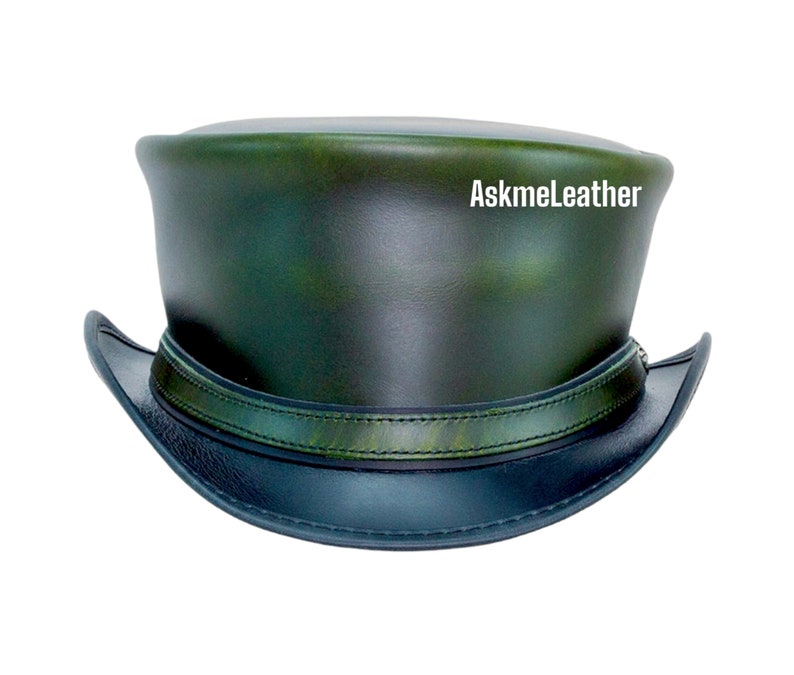 May include: A green leather top hat with a black leather band and brim. The hat has a distressed look and the text "AskmeLeather" is visible on the top.