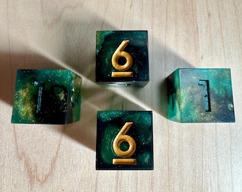 May include: Four green and gold dice with gold numbers. The dice are 1, 1, 6, and 6.