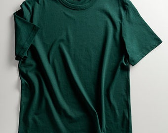 May include: A dark green t-shirt with short sleeves and a crew neck.