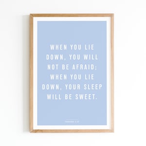 May include: A light blue framed print with a white background and white text that reads "WHEN YOU LIE DOWN, YOU WILL NOT BE AFRAID; WHEN YOU LIE DOWN, YOUR SLEEP WILL BE SWEET.  PSALMS 3:5".