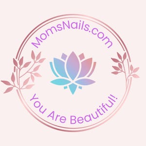 May include: A circular logo with a gradient lotus flower in shades of blue, purple, and pink. The text "MomsNails.com" arches above the flower, and "You Are Beautiful!" curves below. The logo is framed by a rose gold double circle and floral accents.