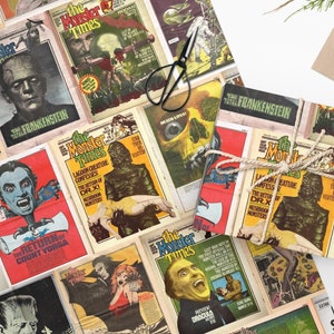 May include: A sheet of wrapping paper with a vintage monster movie theme. The paper features images of Frankenstein, Dracula, and other classic monsters. The paper is printed in black, white, and red.