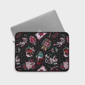 May include: Black laptop sleeve with a repeating pattern of colorful traditional tattoo designs including roses, hearts, anchors, skulls, snakes, and tigers on a black background with white polka dots.