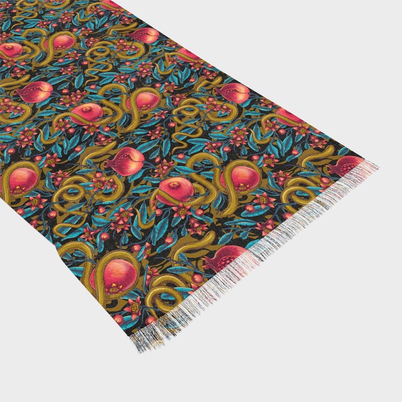 Our Pomegranate Snakes Light Scarf is transparent and printed in detail making a great shawl, hip scarf, or scarf through fall and winter. Great for fans of dark coquette, gothic femme, romantic, mystic, magic, high priestess, witchy inspired styles.