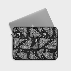 May include: Black laptop sleeve with a white pattern of moths, stars, and skulls.