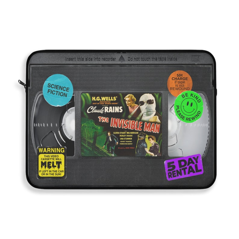 Retro Horror VHS Laptop Sleeve available in three sizes to protect your laptop. Printed on one side with a black backside, edging and zip, the perfect addition to your movie monsters, 80s, 90s, VHS tape Frankenstein, Dracula, themed desk or computer.