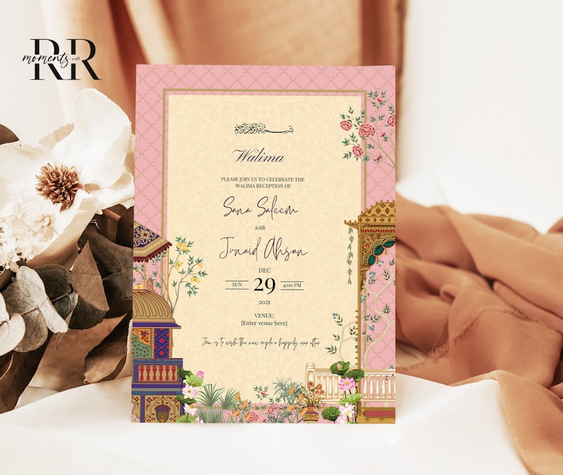 May include: A pink and gold wedding invitation with intricate floral designs and a calligraphic inscription that reads "Walima". The invitation announces the wedding reception of Sana Saleem and Junaid Ahsan on December 29th, 2021.