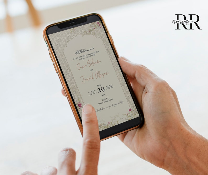 May include: A digital wedding invitation on a smartphone screen. The invitation is for the wedding of Sara Saleem and Junaid Ali, on December 29th, 2024. The invitation features a floral design with a light brown background.