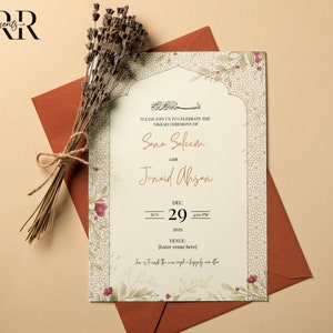 May include: A white wedding invitation with a floral design and an ornate arch. The invitation announces the Nikkah ceremony of Sana Saleem and Junaid Ahsan on December 29, 2021, at 4:00 PM. The venue is not specified.