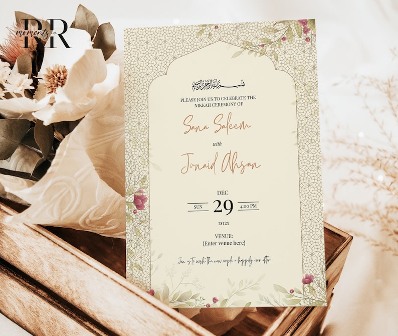 May include: A cream-colored wedding invitation with a floral design and an ornate archway. The invitation reads "Please join us to celebrate the Nikkah Ceremony of Sana Saleem with Junaid Ahsan" and includes the date "Sun Dec 29, 2021, 4:00 PM".