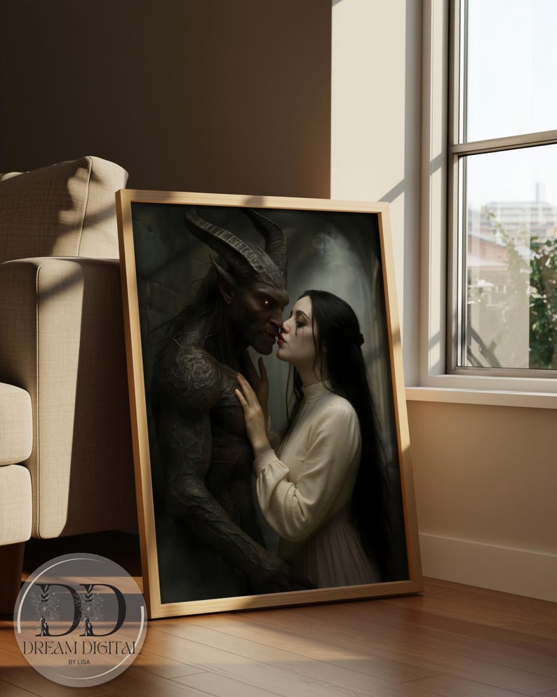 May include: A framed rectangular wall art print featuring a dark-skinned horned creature with glowing eyes standing close to a person with long black hair wearing a cream-colored long-sleeved dress. The print includes the text Dream Digital by Lisa.