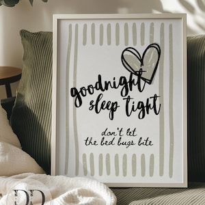 May include: Framed wall art with the text "goodnight sleep tight don't let the bed bugs bite" in black script. The art features a heart and vertical lines in a neutral color palette, perfect for a bedroom or nursery.