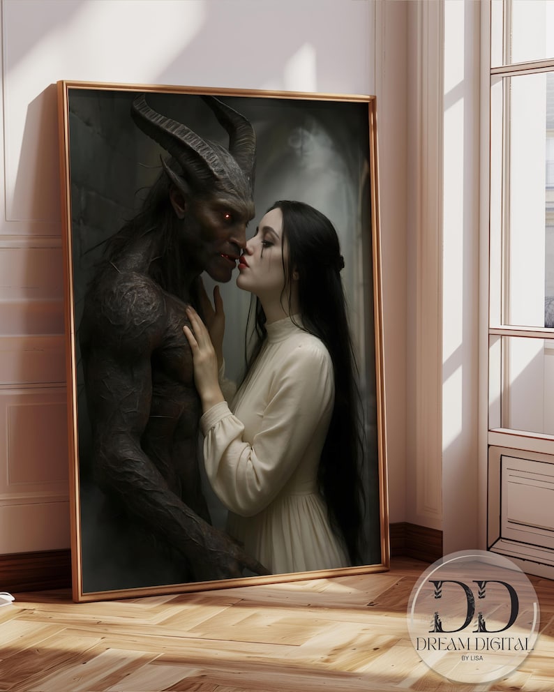 May include: A framed digital art print depicting a dark-skinned, horned creature with glowing orange eyes facing a person with long black hair wearing a cream-colored long-sleeved dress. The print includes the text DD DREAM DIGITAL BY LISA.